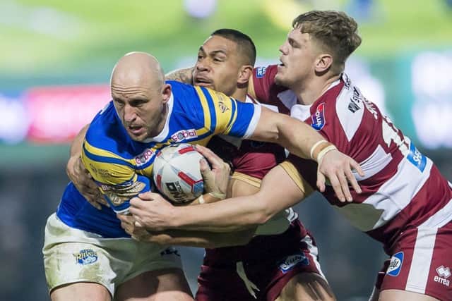 Leeds's Carl Ablett is tackled by Wigan's Willie Isa & Ryan Sutton. Picture: Allan McKenzie/SWpix.com