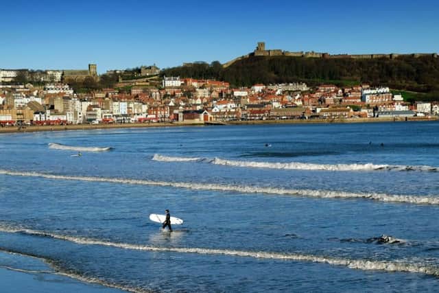 A surfer leaves the sea at Scarborough's South Bay. PIC: Simon Hulme