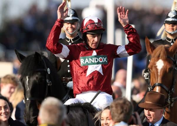 Davy Russell celebrates his Grand National win on Tiger Roll.
