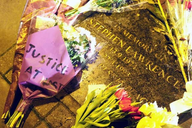 Flowers and tributes left on the memorial stone for Stephen Lawrence. Picture: Ian West/PA Wire.