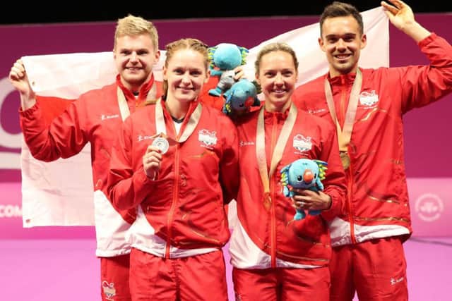 England's (left-right) Marcus Ellis and Lauren Smith, silver, England's Chris Adcock and Gabriell Adcock, gold, in the Mixed Doubles Badminton, at the Carrara Sports Arena during day eleven of the 2018 Commonwealth Games in the Gold Coast, Australia.