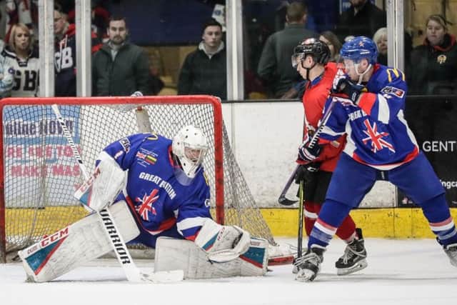 WARMING UP: GB goaltender Jackson Whistle battles for the puck in front of his net against Lithuania in Coventry on Sunday night. Picture: Tony Sargent/TeamGB