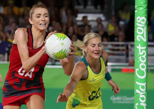 England's Helen Housby battles for the ball with Australia's April Brandley in the Women's Netball gold medal match (Picture: Martin Rickett/PA Wire)