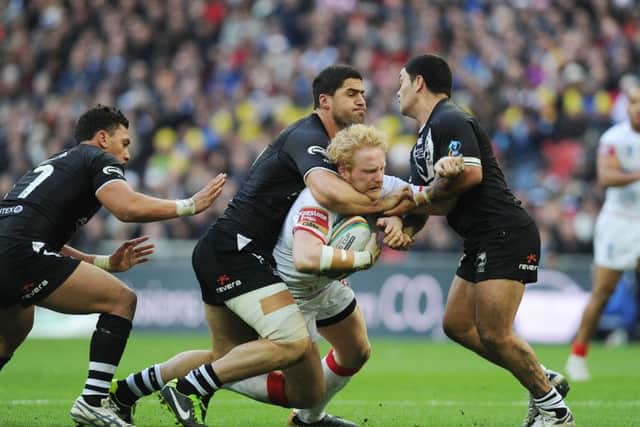 SEE YOU IN DENVER! England's James Graham is tackled by New Zealand's Jesse Bromwich (centre) and Isaac Luke (right) during the World Cup semi-final at Wembley four years ago. Picture: Anna Gowthorpe/PA Wire