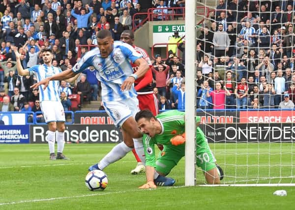 Huddersfield Town's Collin Quaner is thwarted by Watford's Orestis Karnezis during Saturday's Premier League match at the John Smith's Stadium ( Picture: Dave Howarth/PA Wire).