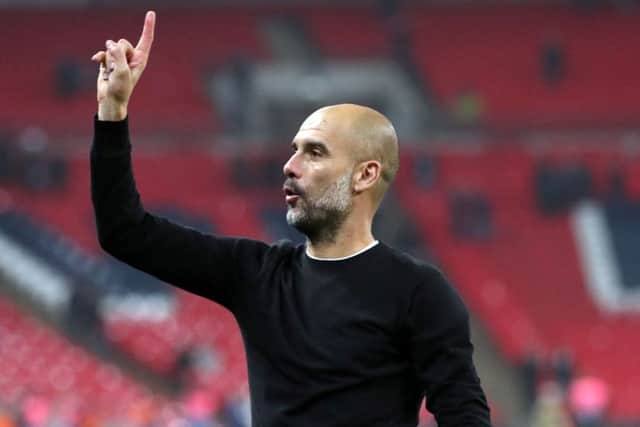 TEACHER: Manchester City's Pep Guardiola makes a point to the fans after the Premier League win against Tottenham at Wembley Stadium on Saturday. Picture: Adam Davy/PA.