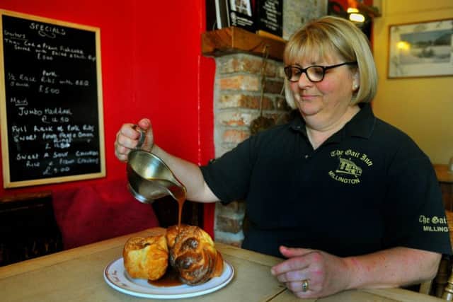 Helen Stephenson serves up Yorkshire Puddings and gravy.