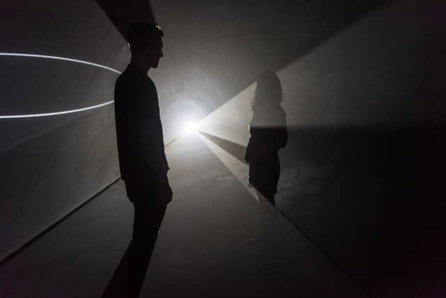 Visitors look at Face to Face, 2013 by Anthony McCall, The Hepworth Wakefield, Wakefield. Photo by Darren O'Brien/Guzelian.