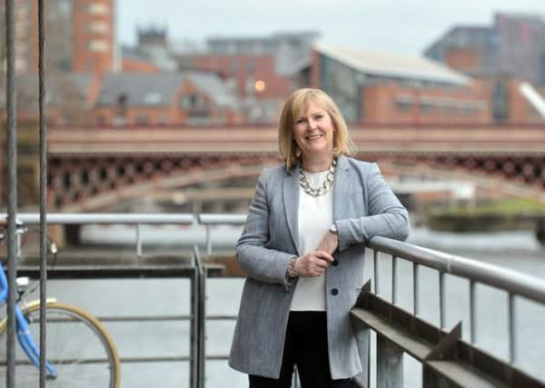 17 April  2018......   Screen Yorkshire chief executive Sally Joynson photographed with the iconic Leeds Bridge in the background.. Picture Tony Johnson.
