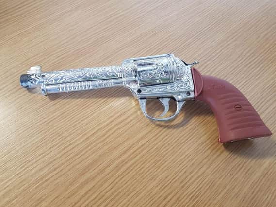 The 'gun' found in the man's bag (which turned out to be a child's toy)