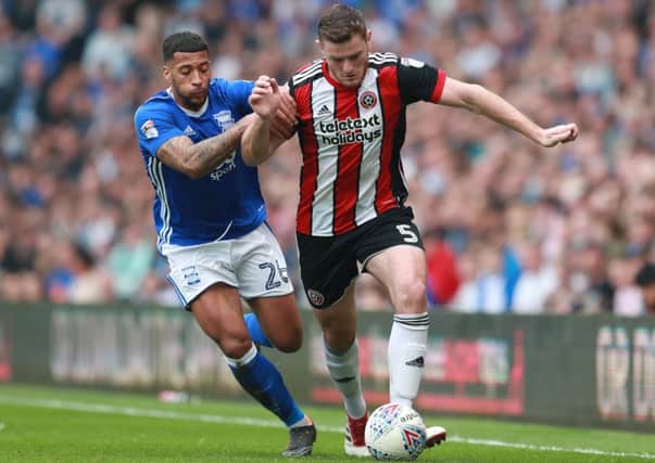 Jack O'Connell of Sheffield Utd tackled by David Davis of Birmingham City. Picture: Simon Bellis/Sportimage