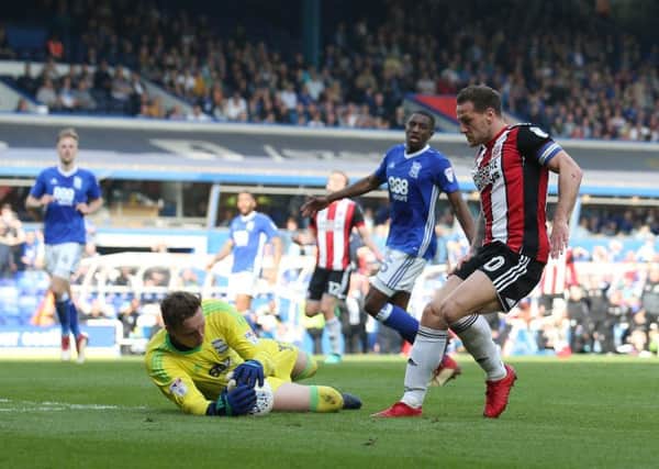 David Stockdale of Birmingham City saves at the feet of Billy Sharp. Picture: Simon Bellis/Sportimage