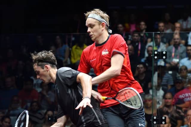 TOUGH GOING: James Willstrop battles with Paul Coll during the men's singles final on the Gold Coast. Picture: Toni van der Kreek/World Squash Federation.