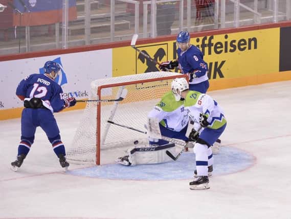 RIGHT PLACE, RIGHT TIME: Rob Dowd (No 12) taps home a mid-air puck to make it 2-1 to Great Britain against Slovenia in Budapest. Picture: Dean Woolley.