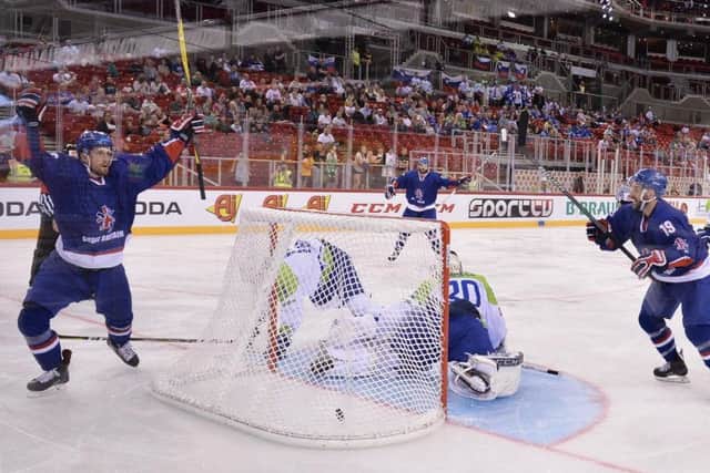 WELL-WORKED: Brett Perlini, far left, celebrates after scoring to make it 3-1 to Great Britain against Slovenia in Budapest. Picture: Dean Woolley.