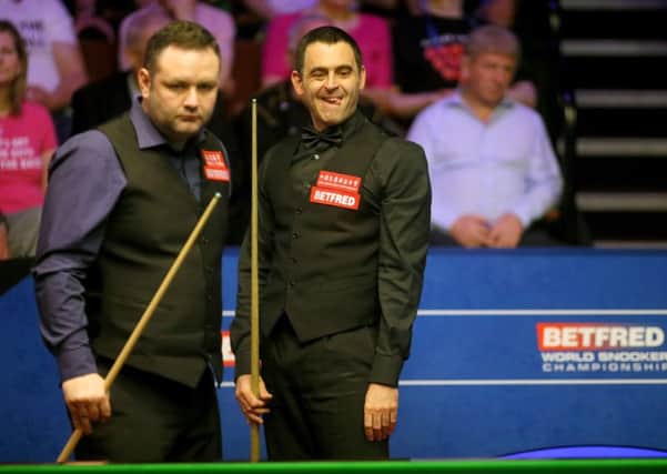 Stephen Maguire and Ronnie O'Sullivan in action.