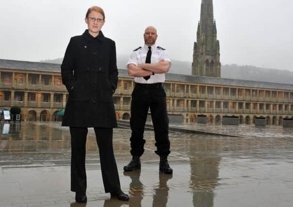 Holly Lynch MP with Chief Inspector Nick Smart, Chair of West Yorkshire Police Federation, on a walkabout  in the Piece Hall, Halifax.