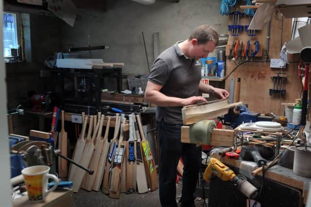 Cricket craft: James Dollive at work, crafting Viking Cricket bats.  Picture: Tony Johnson.
