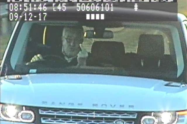 The man giving a speed camera the middle finger