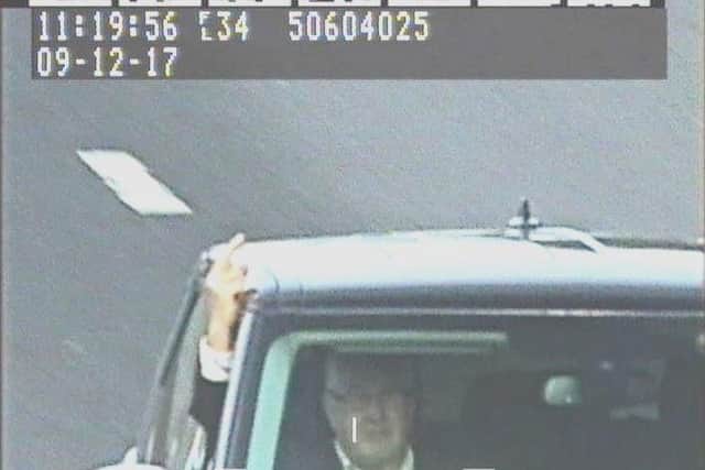 The man giving a speed camera the middle finger