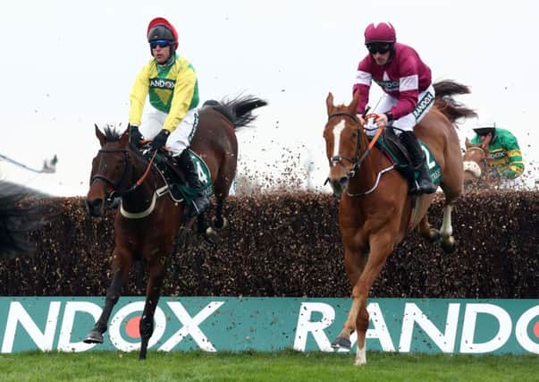 Finian's Oscar (left) ridden by Robbie Power on their way to winning the Big Buck's Celebration Manifesto Novices' Chase during day one of the 2018 Randox Health Grand National Festival at Aintee.