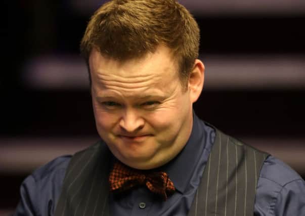 Former world champion Shaun Murphy grimaces as he surveys a shot during his defeat to Jamie Jones Picture: Simon Cooper/PA Wire).
