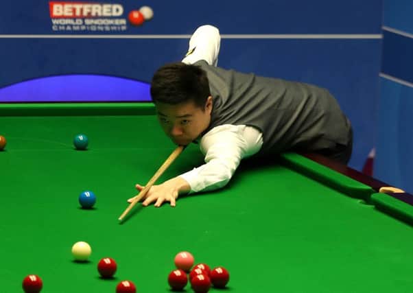 EASING THROUGH: Ding Junhui in action against Xiao Guodong at The Crucible on Tuesday morning. Picture: Simon Cooper/PA
