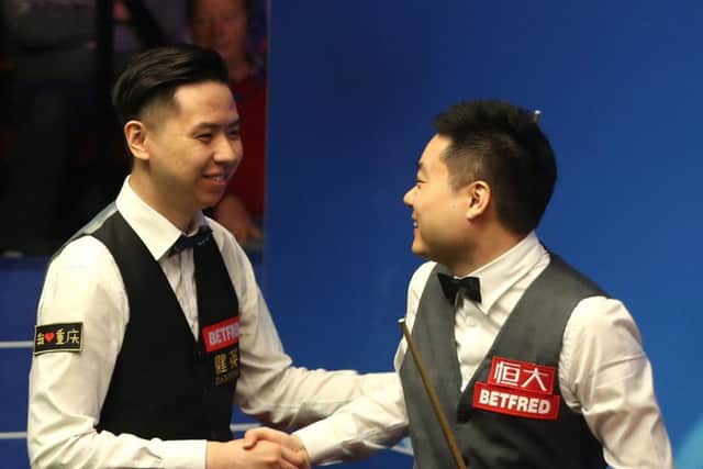 Ding Junhui is congratulated by Xiao Guodong. Picture: Simon Cooper/PA