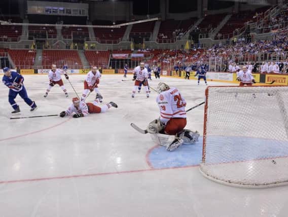 Brendan Brooks, far left, scores the game-tying goal in the third period for GB against Poland. Picture: Dean Woolley.