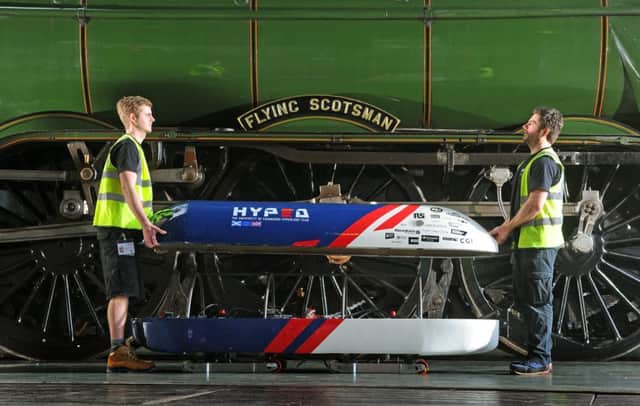 Workers assemble the Hyperloop Pod next to Flying Scotsman at the National Railway Museum. Picture: Tony Johnson.