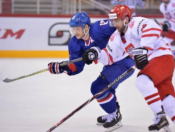 BATTLE: Rob Dowd fights for possession against Poland in Budapest on Wednesday. Picture: Dean Woolley.