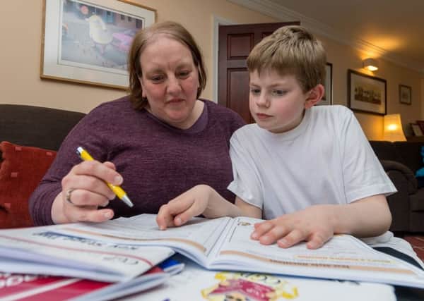 Shain Wells, of Menston, Leeds, with her son Mitchell, aged 10, who has autism and who is fearful about the impact of special needs education cuts.