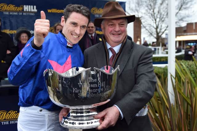 Jockey Paddy Brennan and trainer Colin Tizzard celebrate Cue Card's King George Chase win in 2015.