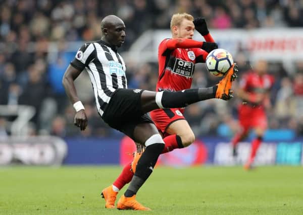 Huddersfield Town's Alex Pritchard, right, duels with Newcastle United's Mohamed Diame at St James' Park (Picture: Owen Humphreys/PA Wire).