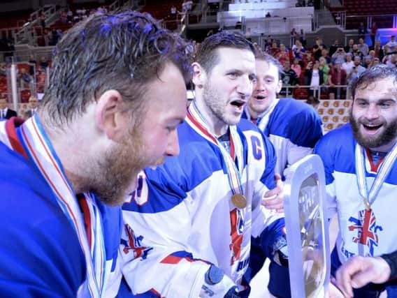 MAGIC MOMENT: Sheffield Steelers and GB captain Jonathan Phillips celebrates with the Division 1A trophy with team-mates Ben O'Connor, left, and Robert Farmer, right. Picture: Dean Woolley.