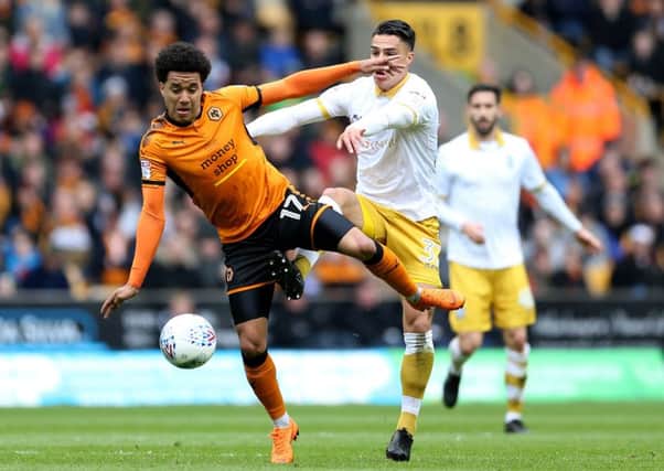 Tussle: Wolverhampton Wanderers' Helder Costa and Sheffield Wednesday's Joey Pelupessy battle for the ball.
