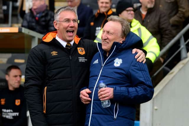 Hull City head coach Nigel Adkins shares a joke with Cardiff manager Neil Warnock (Picture: James Hardisty)
