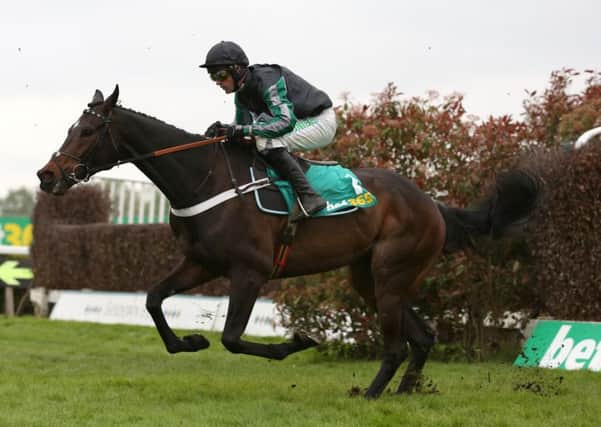Signing off: Altior ridden by Nico de Boinville clears an early fence to win on Jump Finale day at Sandown Park. (Pictures: Julian Herbert/PA).