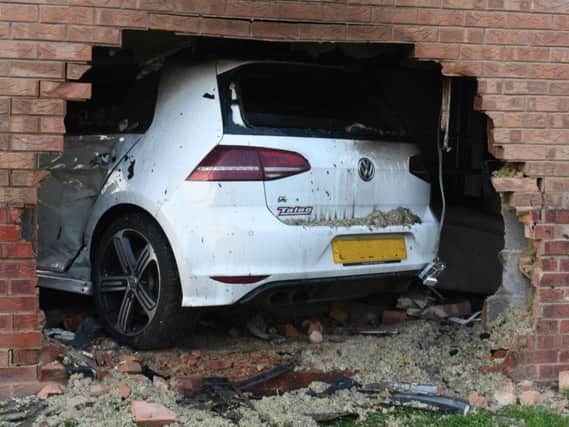 Sparham's high-performance car smashed through the wall into the family's living room