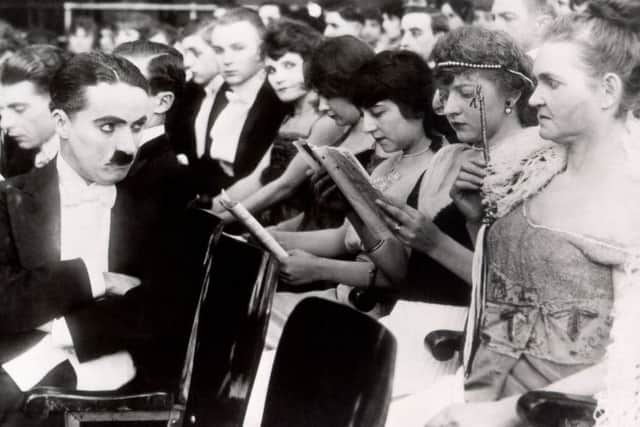 Hero: Charlie Chaplin seen here in A Night in the Show.