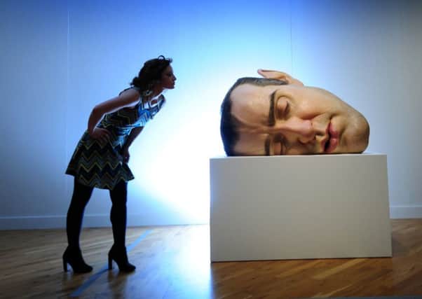 Hannah Scorer looks at the Sculpture Mask 11 by Ron Mueck at the Ferens Art Gallery, Hull. Picture by Simon Hulme