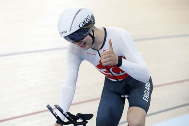 OH BROTHER: England's Charlie Tanfield celebrates setting a new games record in the Men's 4000m Individual Pursuit at the Commonwealth Games on the Gold Coast. Picture: Martin Rickett/PA