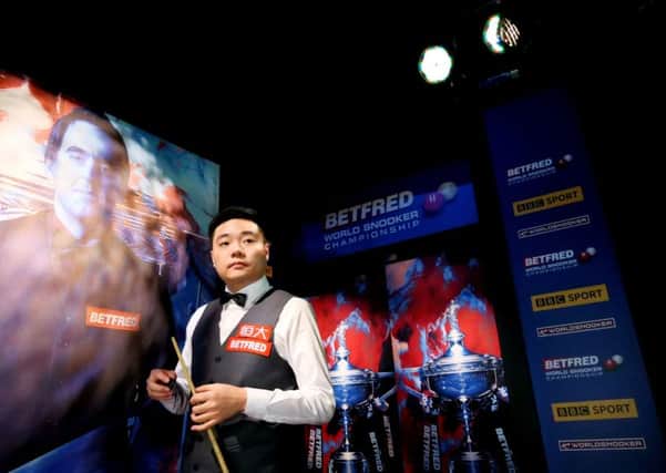 Sheffield-based Ding Junhui gathers himself ahead of beginning his match against Barry Hawkins in the Betfred World Championship at the Crucible. Ding appears on the brink of losing with an 11-5 deficit to overhaul on Wednesday(Picture: Tim Goode/PA Wire).