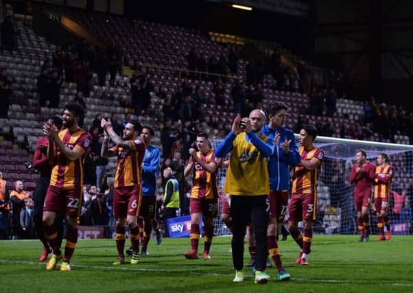 Bradford Citys players applaud those fans who stayed behind after the 1-1 draw with Walsall to show their appreciation at the final home act of a disappointing season (Picture: Bruce Rollinson).