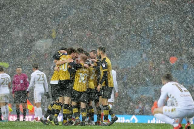 Sheffield Wednesday celebrate their win in the snow at full-time against 
Leeds United (Picture: Bruce Rollinson)