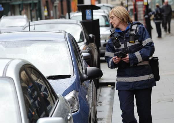 Civil Enforcement Officer Denise Goddard out in Sheffield. Picture Scott Merrylees