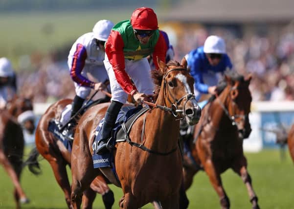 Billesdon Brook, foreground, surges home to win the Qipco 1000 Guineas Stakes ahead of Laurens, left (Picture: PA Wire).