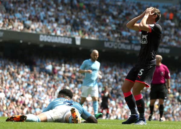 Huddersfield Town's Chris Lowe reacts after a missed opportunity for the visitors to score against Manchester City (Picture: Martin Rickett/PA Wire).