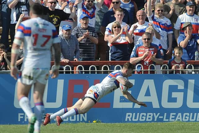 Tom Johnstone dives over for a try.