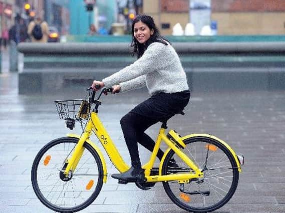 Priya Rane trying out an ofo bike in Sheffield.